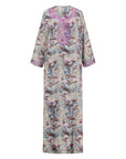 The Azalea Mukhawar Dress features a vibrant floral design, a flattering belt, and handcrafted satin elegance, available in five stunning colors and versatile for any occasion.