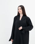 A sleek plain abaya with a collar design, available in black, grey, beige, deep green, and dark brown, crafted for elegance and comfort in sizes 50-60. Includes a complimentary hijab.