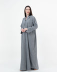 A sleek plain abaya with a collar design, available in black, grey, beige, deep green, and dark brown, crafted for elegance and comfort in sizes 50-60. Includes a complimentary hijab.