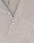 A sleek plain abaya with a collar design, available in black, grey, beige, deep green, and dark brown, crafted for elegance and comfort in sizes 50-60. Includes a complimentary hijab.