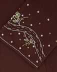 Reema Abaya available in Black, Vanilla, and Chocolate Brown with golden and silver beaded sleeves in a floral and leafy design. Made from crepe fabric with popper buttons, available in sizes 50-60. Includes a matching hijab.
