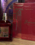 Collection of perfume bottles and boxes on a wooden shelf