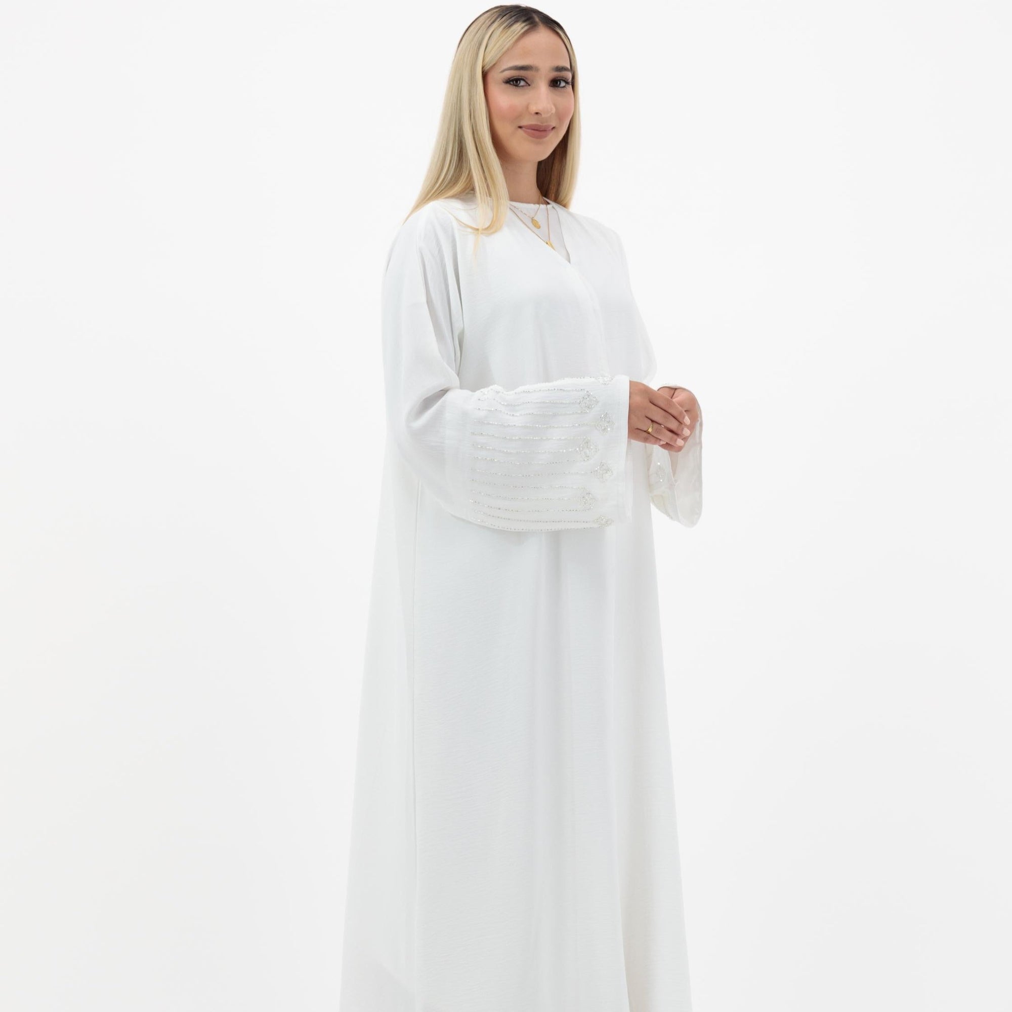 Amelia open abaya with detailed sleeves, available in sizes 52-58. Crafted from soft, flowing fabric, it offers an elegant, modest look for formal occasions, Eid celebrations, and professional events. Comfortable fit and easy-care, hand wash only.