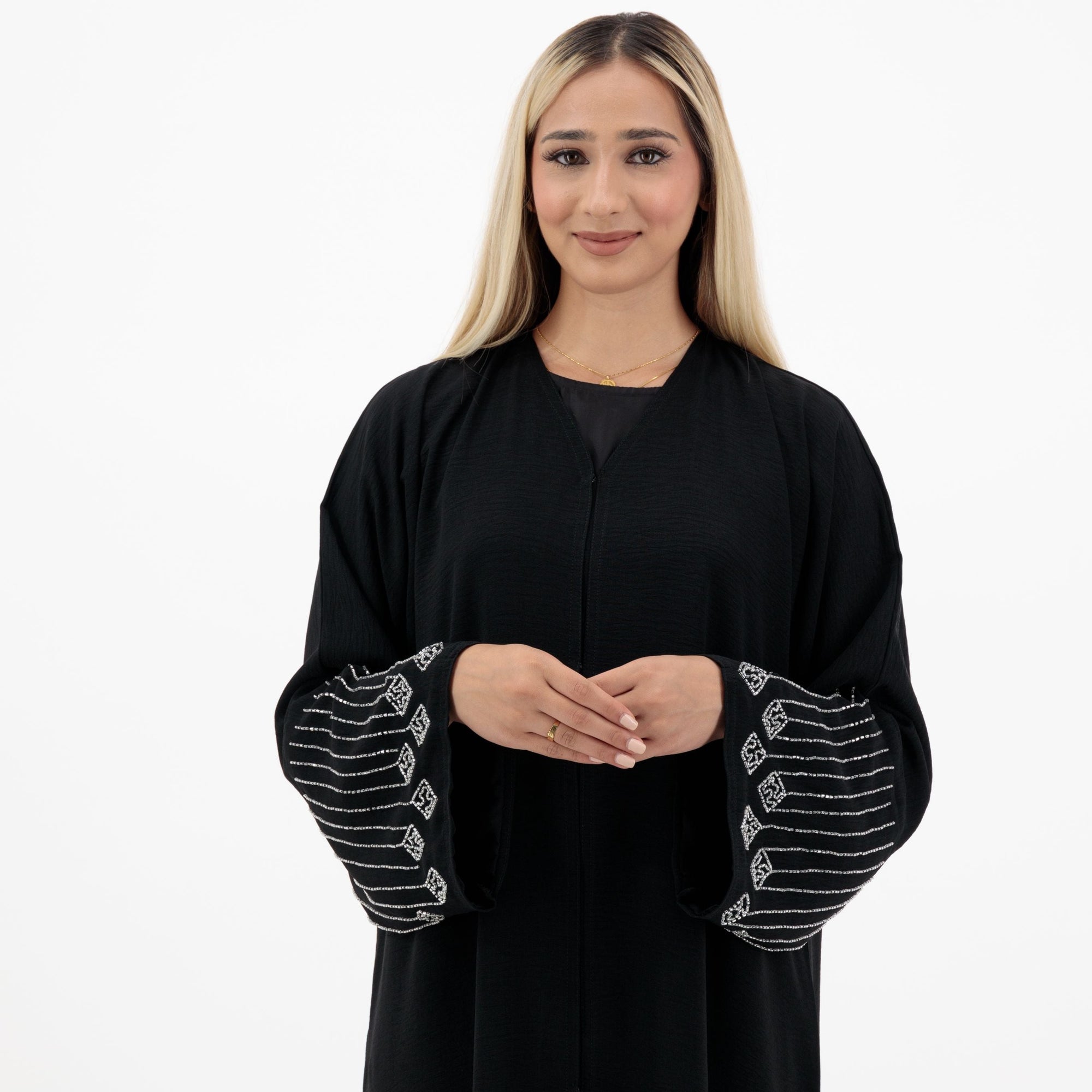 Amelia open abaya with detailed sleeves, available in sizes 52-58. Crafted from soft, flowing fabric, it offers an elegant, modest look for formal occasions, Eid celebrations, and professional events. Comfortable fit and easy-care, hand wash only.