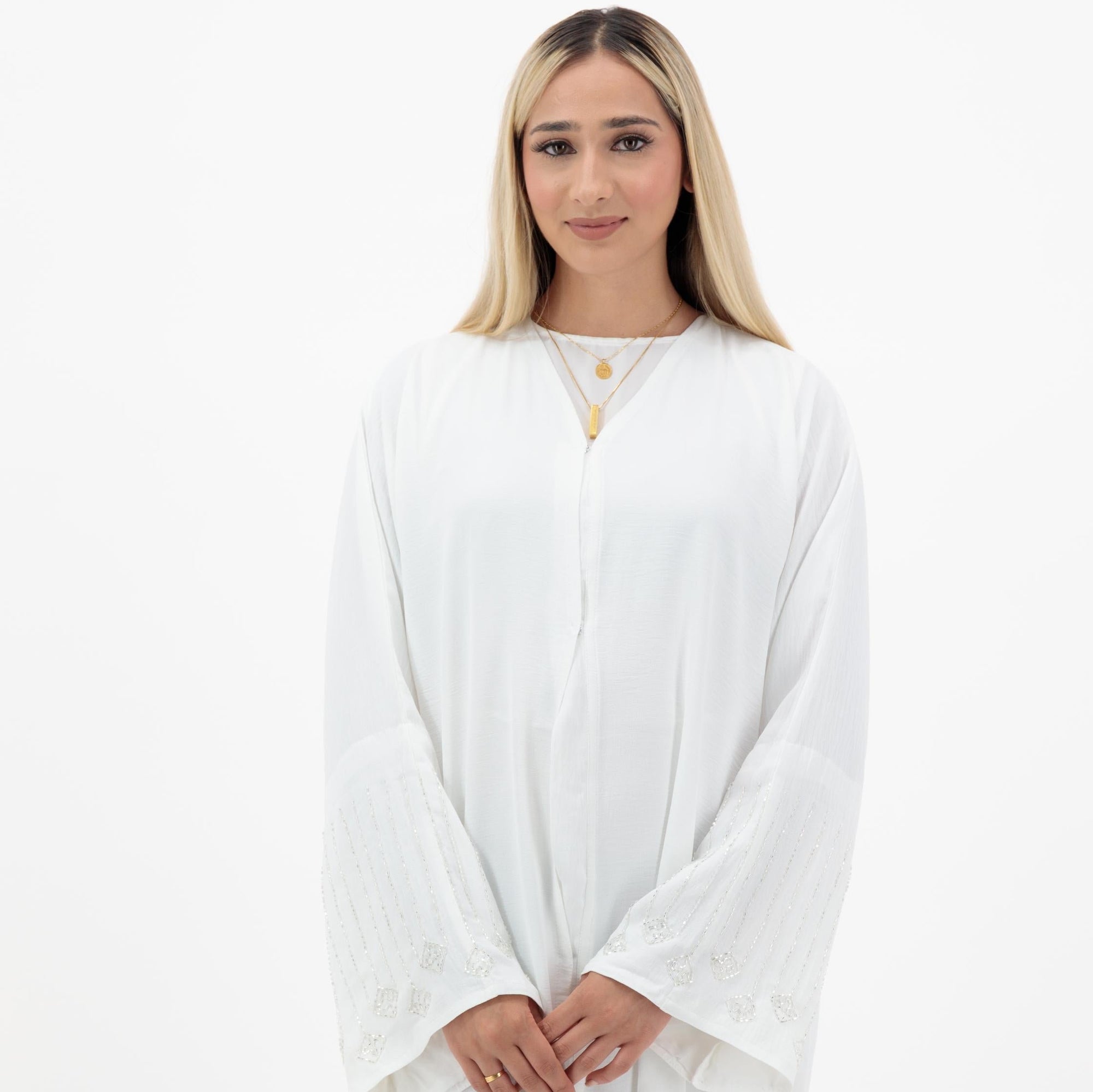 Amelia open abaya with detailed sleeves, available in sizes 52-58. Crafted from soft, flowing fabric, it offers an elegant, modest look for formal occasions, Eid celebrations, and professional events. Comfortable fit and easy-care, hand wash only.