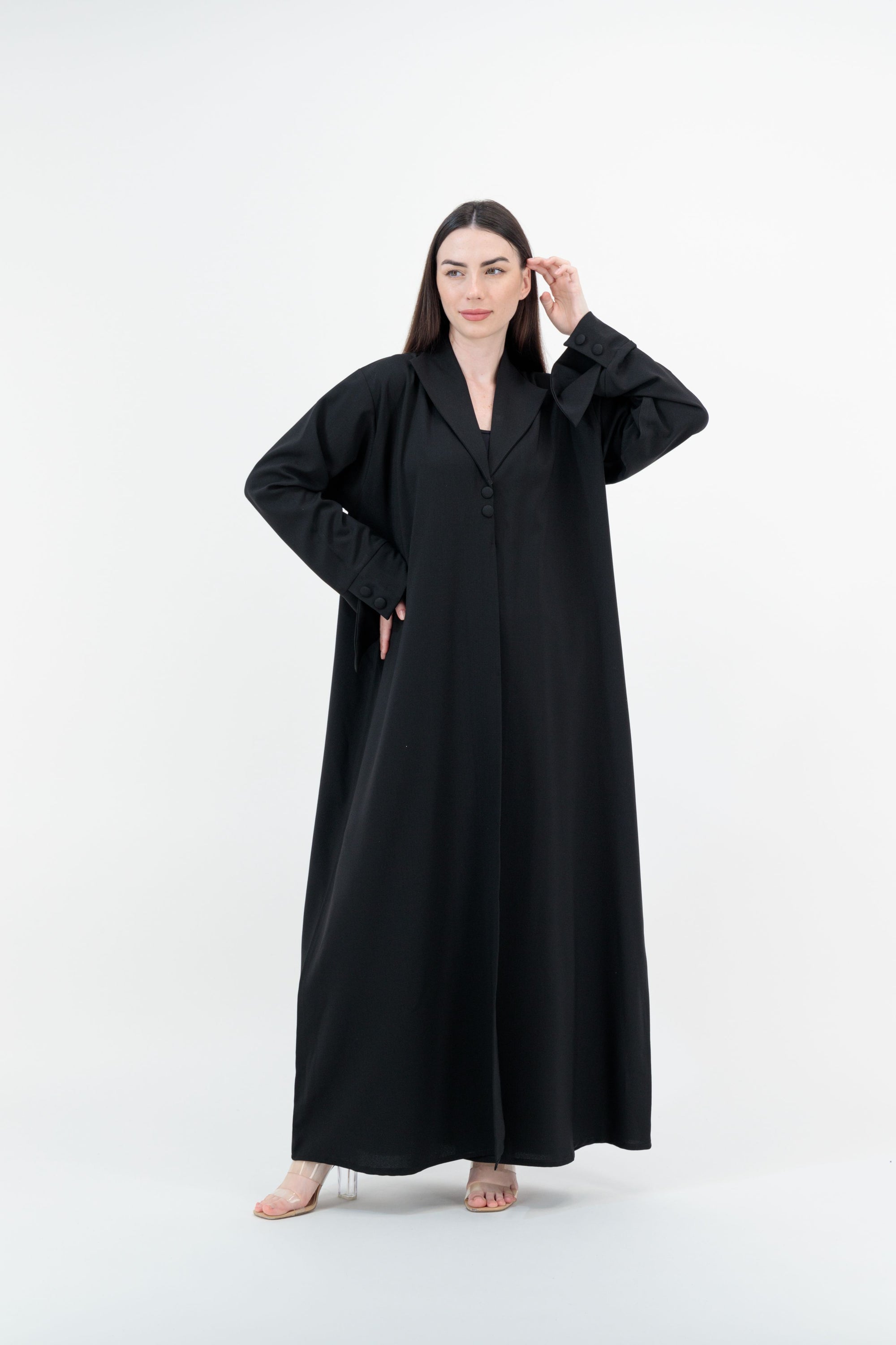 
A sleek plain abaya with a collar design, available in black, grey, beige, deep green, and dark brown, crafted for elegance and comfort in sizes 50-60. Includes a complimentary hijab.