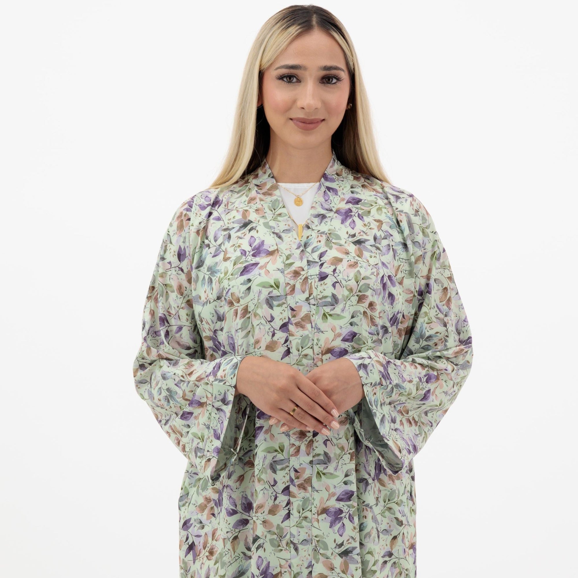 Mahrah Abaya available in Pale Pink, Beryl Green, Quill Grey, and Dawn Pink, featuring soft floral prints and popper buttons, made from crepe fabric, available in sizes 50-60.