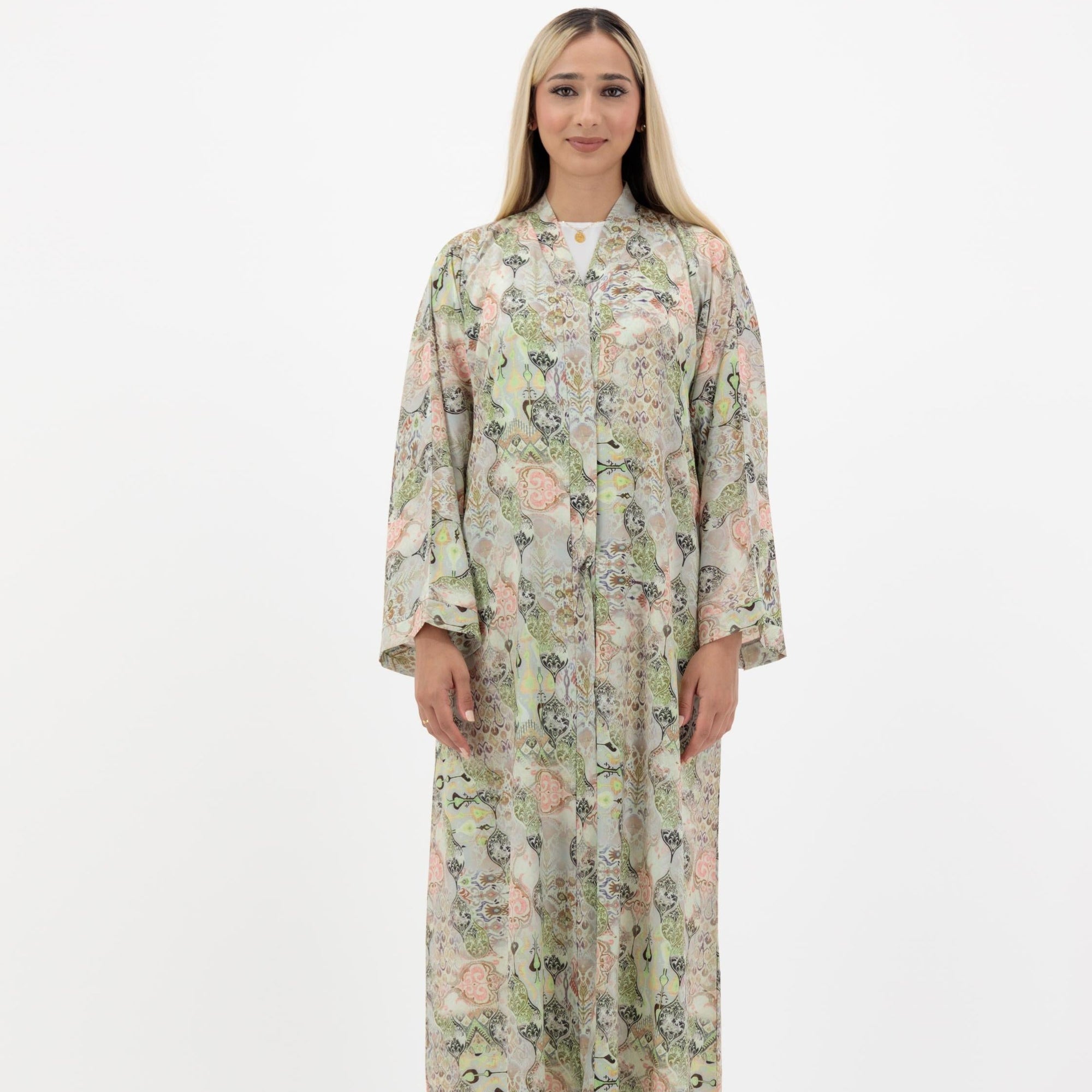 Ruba Abaya available in Pearl Bush, Pastel Grey, and Soft Amber, adorned with subtle floral prints and popper buttons, crafted from crepe material, available in sizes 50-60.