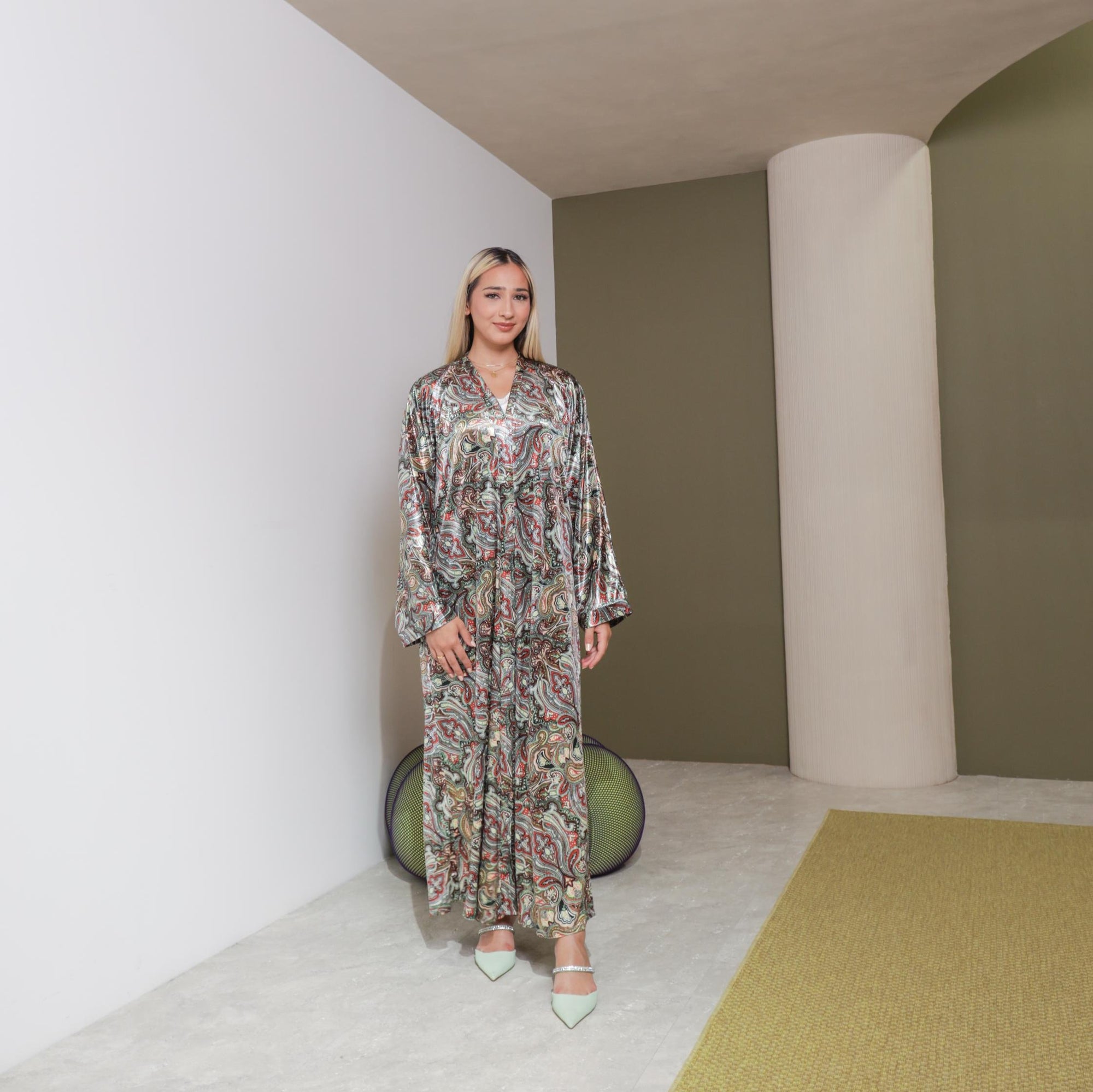 Samra Abaya available in Copper Canyon and Lunar Green, an elegant open abaya with subtle prints, popper buttons, and crafted from crepe material, available in sizes 50-60.